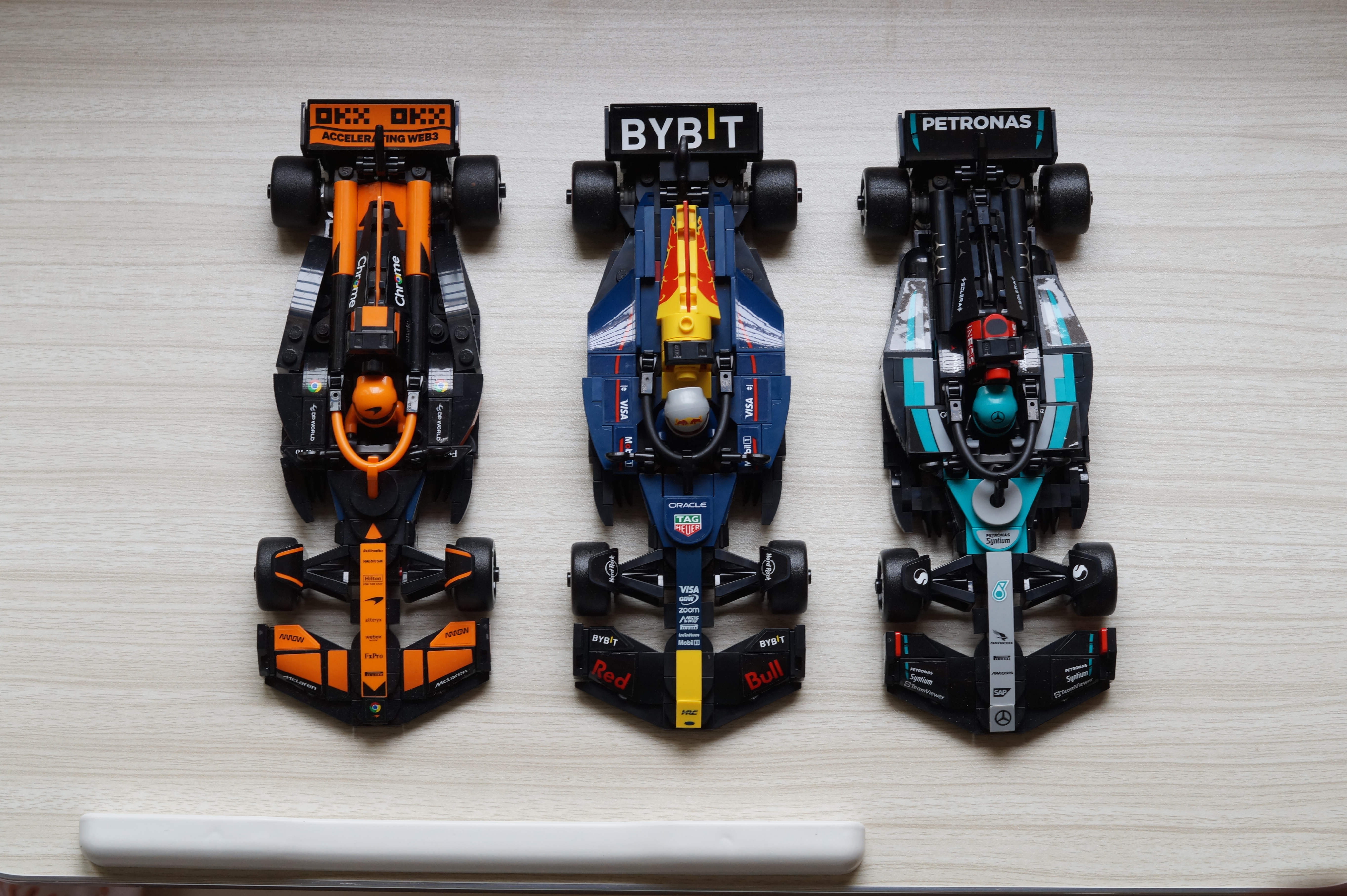 a picture of 3 champion cars in lego form